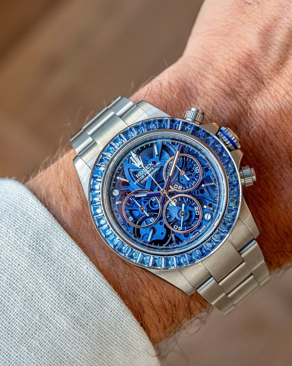 The Arolla on the wrist: a skeletonised Daytona with a translucent blue dial and a bezel set with baguette sapphires, on a steel bracelet