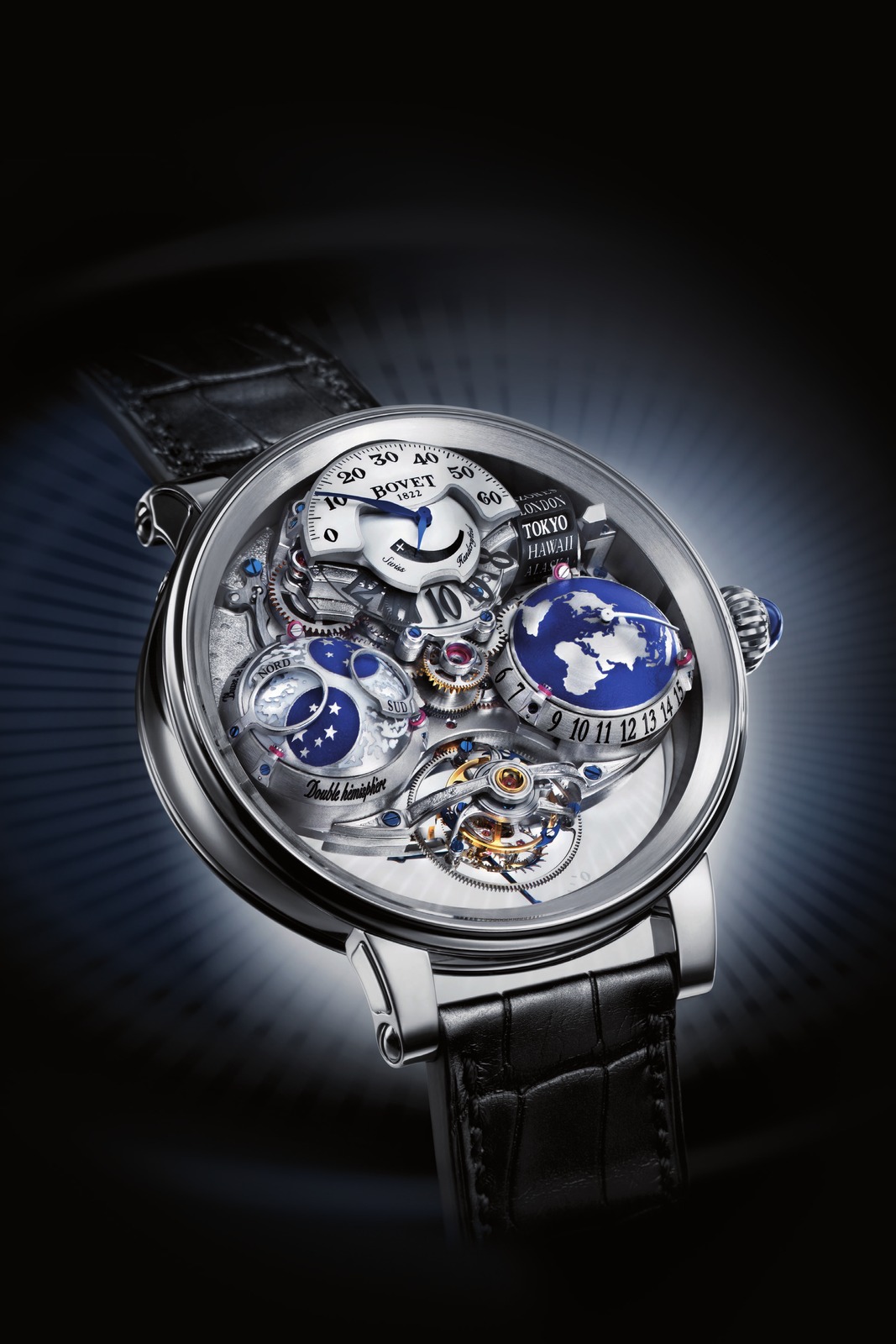 Bovet Récital 18 Shooting Star in white gold on a black alligator strap against a dark backdrop: blue Earth hemisphere at 3, moon hemisphere at 9, jumping hours and retrograde minutes at 12, tourbillon at 6