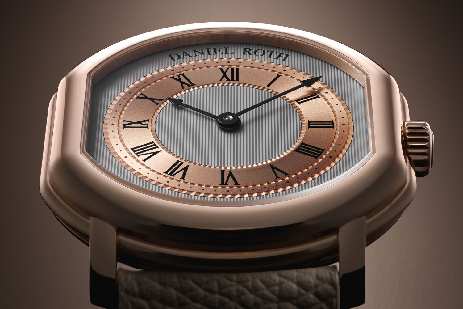 Macro of the two-tone dial: pinstripes guilloché on the white-gold base, rose-gold chapter ring with black Roman numerals, black-coated hands