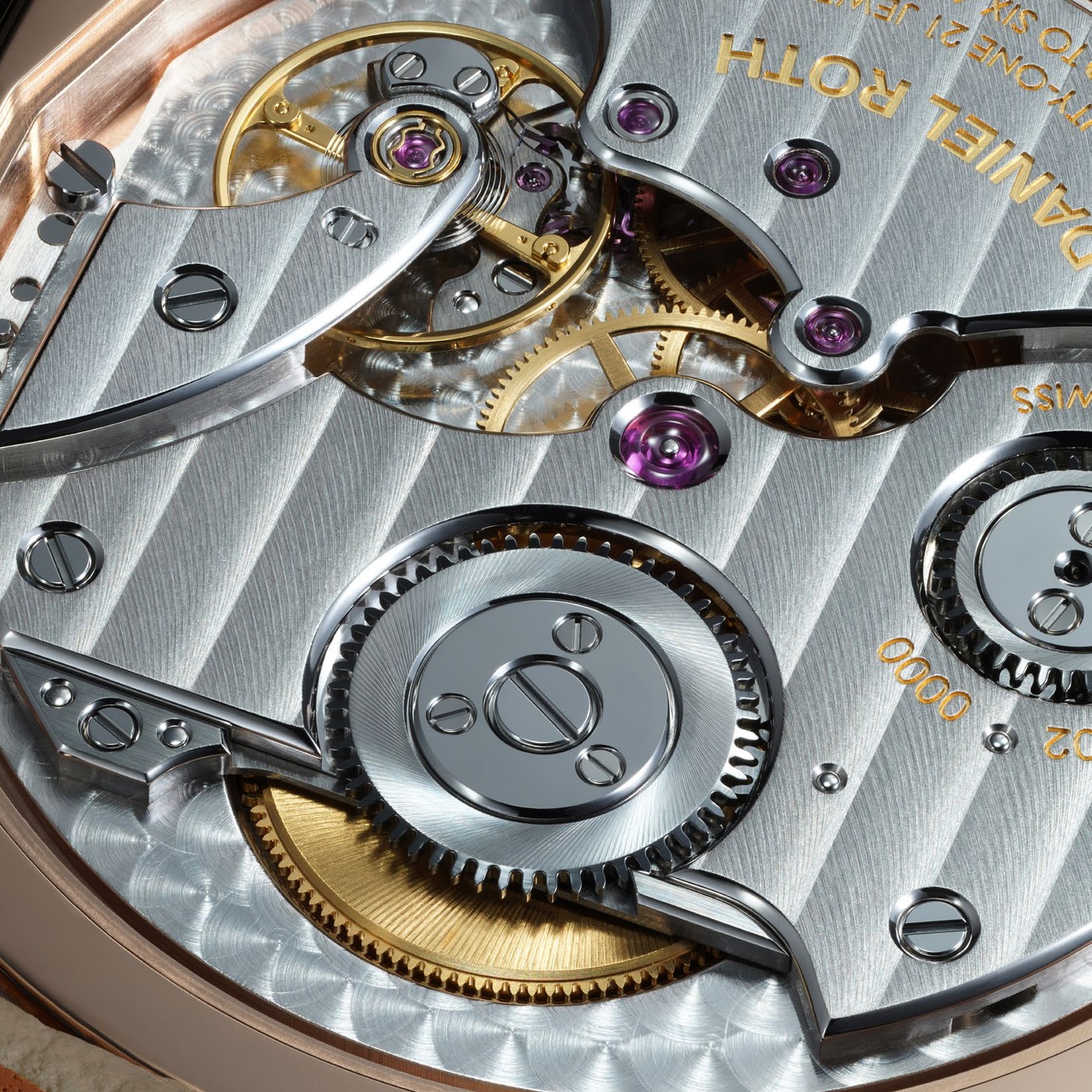Macro of the manual calibre DR002 through the open caseback: striped bridges with polished bevels, jewels, and a gilt wheel