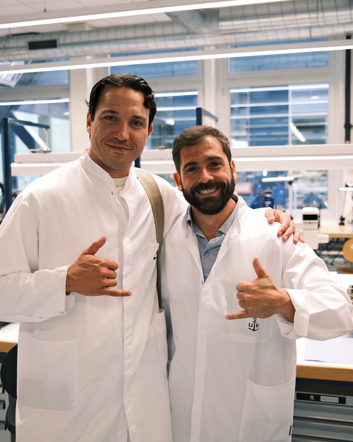 Jimmy Heneidy and Gabriele Ciervo in white workshop coats at the Ulysse Nardin manufacture in Le Locle