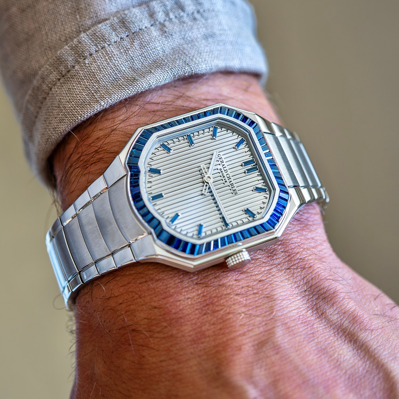 The blue Masterlink Gem-Set seen at an angle, the white-gold baguette bezel standing above the polished steel case outline, brushed centre links of the bracelet