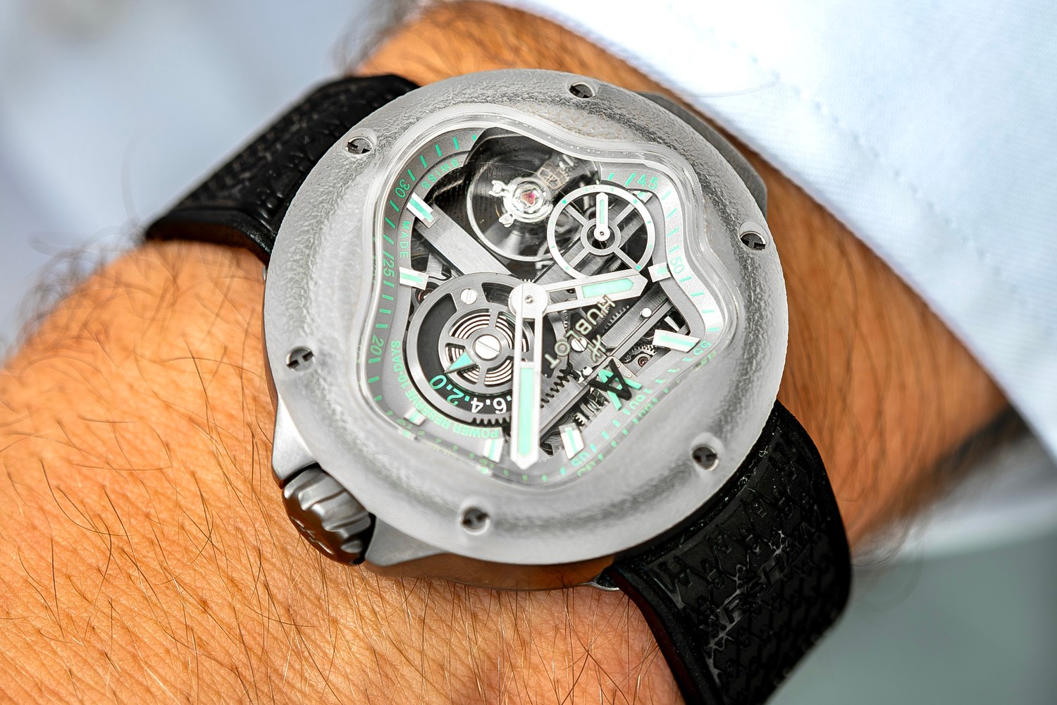 The MP-17 seen at an angle under a cuff, the box-shaped frosted bezel standing above the titanium case