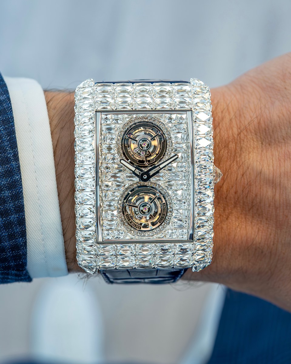 Jacob & Co. Billionaire Double Tourbillon Angel-Cut on a wrist: rectangular case fully set with baguette diamonds, two tourbillons visible through the dial, blue alligator strap