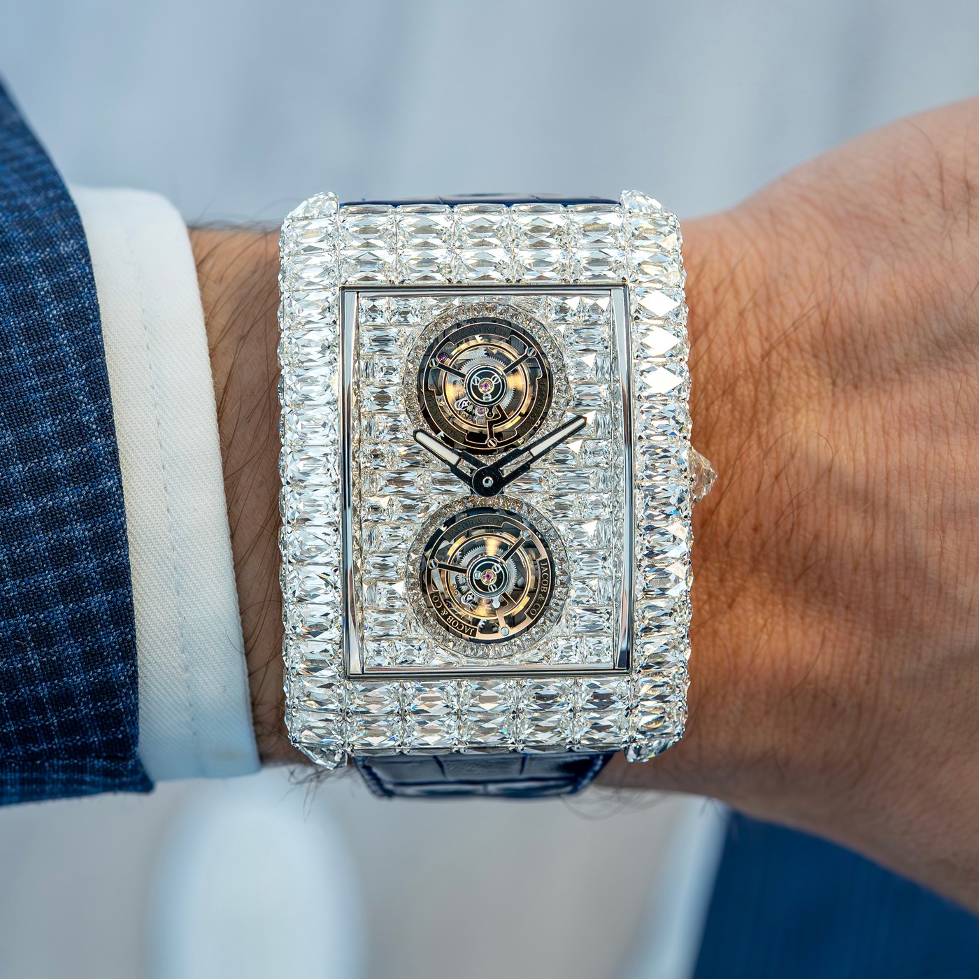 Close view of the white-diamond Angel-Cut dial, with stepped rectangular stones, two tourbillon cages and dark skeleton hands