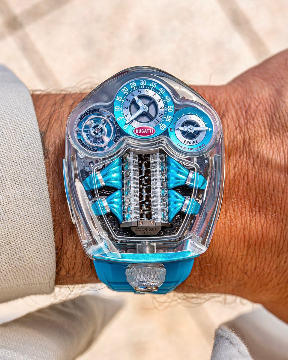 Jacob & Co. Bugatti Tourbillon Sapphire Crystal on a wrist: transparent sapphire case over a blue miniature W16 engine, time and power-reserve dials above it