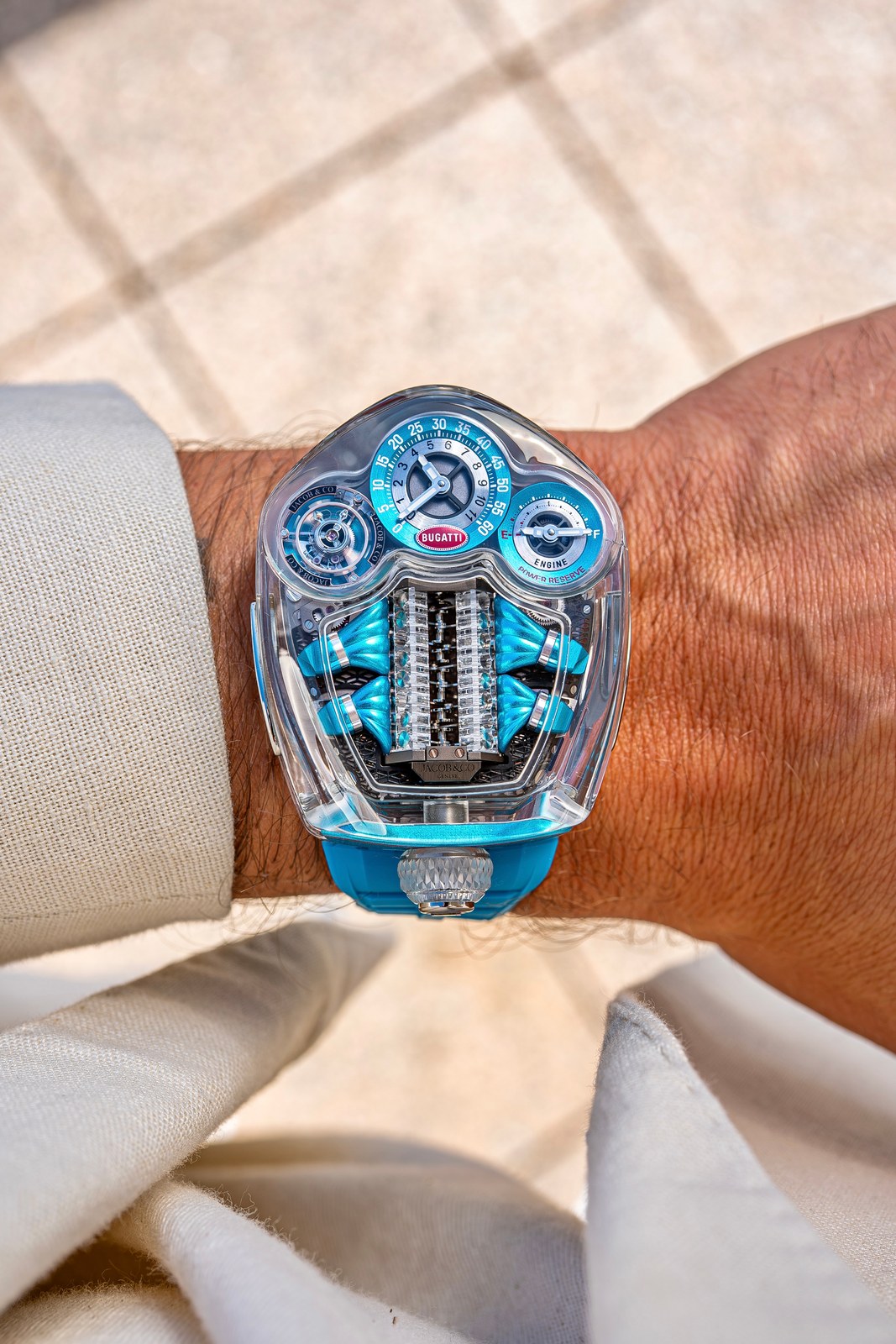 The Bugatti Tourbillon Sapphire Crystal seen straight down on a wrist, the engine block along the centre and the two counters at the top