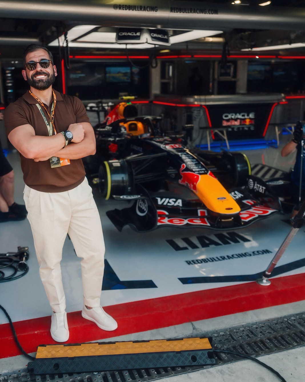 Gabriele Ciervo standing beside the Oracle Red Bull Racing car inside the team's garage at Monza