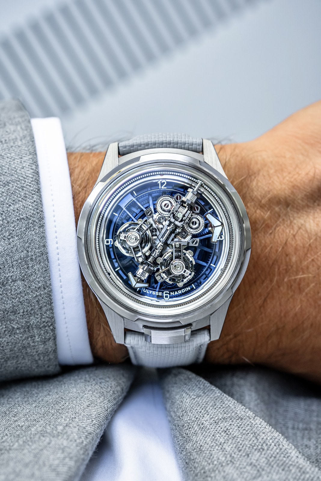 Front view of the Ulysse Nardin Super Freak on a wrist, with the central minute bridge, blue hour disc and twin tourbillons visible