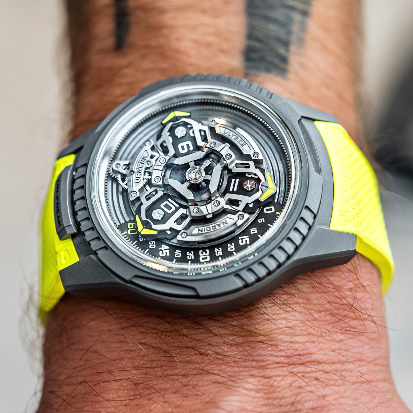 The UR-FREAK from above on a wrist, the three satellite arms, the yellow pointer on the minute arc and fluted sections at the case edge